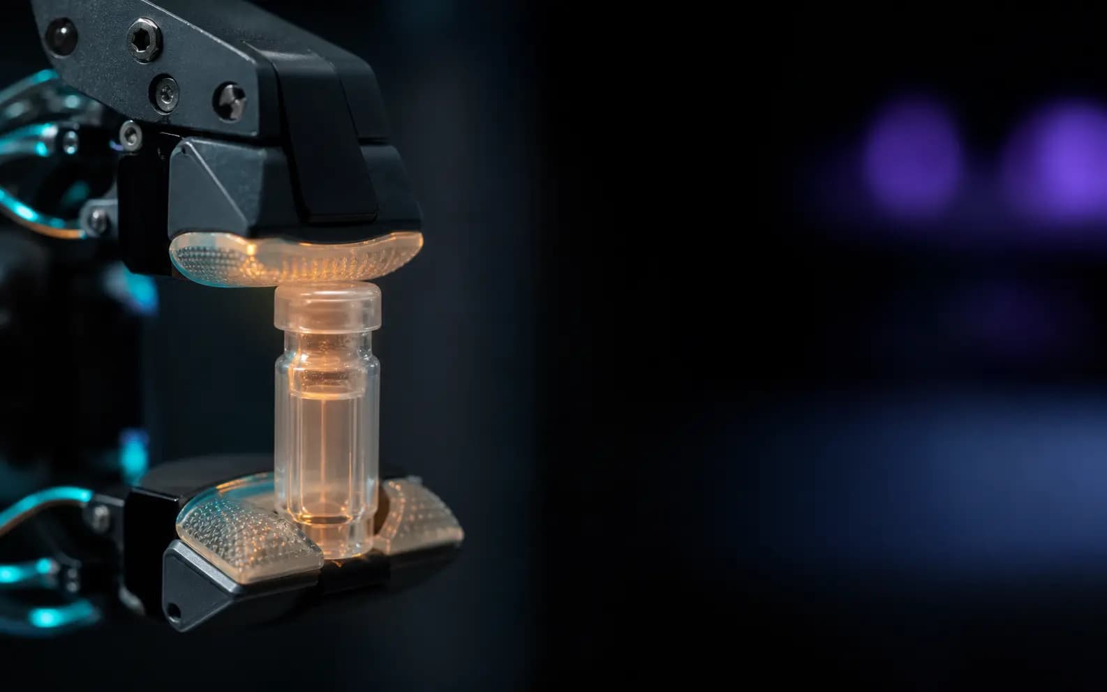 A tactile robotic gripper delicately holding a translucent laboratory vial